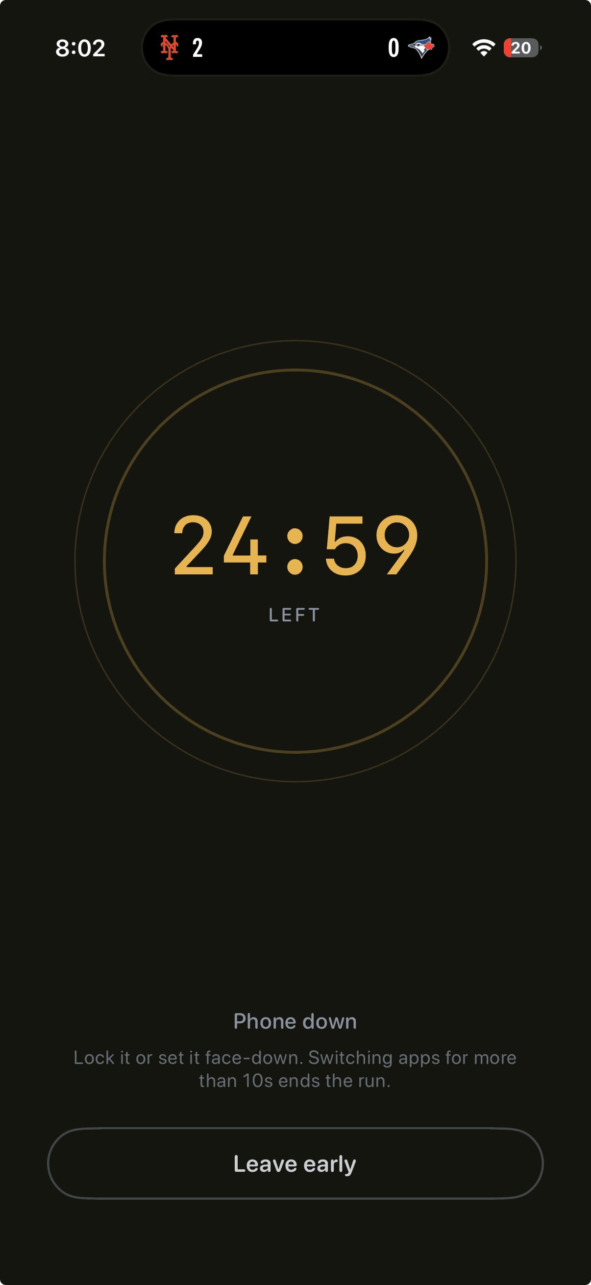 Phones Down focus screen — a gold timer counting down inside a slow breathing ring